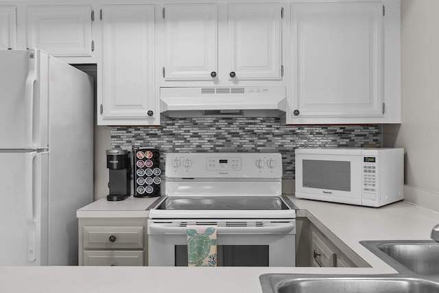 1627 Live Oak Park, Seabrook Island, SC 29455 - kitchen with under cabinet range hood, white appliances, light countertops, and white cabinets
