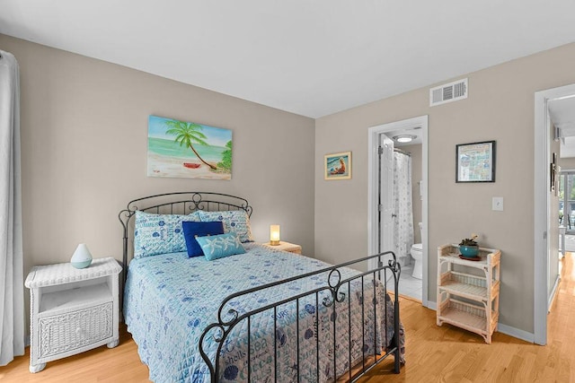 1627 Live Oak Park, Seabrook Island, SC 29455 - bedroom featuring light wood-style floors, baseboards, and connected bathroom