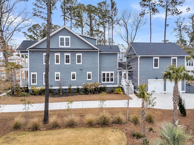 back of house featuring a garage