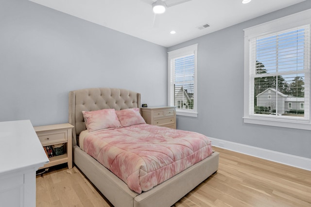 bedroom featuring light hardwood / wood-style floors and ceiling fan