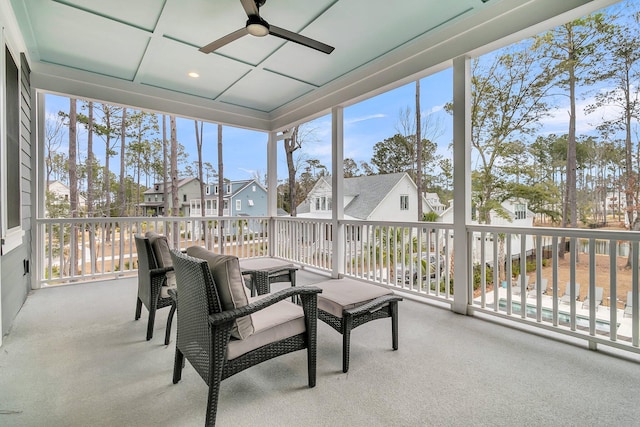 sunroom with ceiling fan and a wealth of natural light