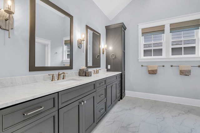 bathroom featuring vanity and vaulted ceiling