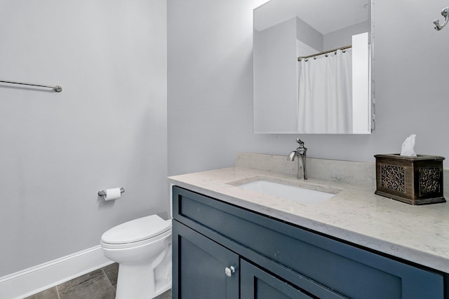 bathroom with curtained shower, tile patterned floors, vanity, and toilet