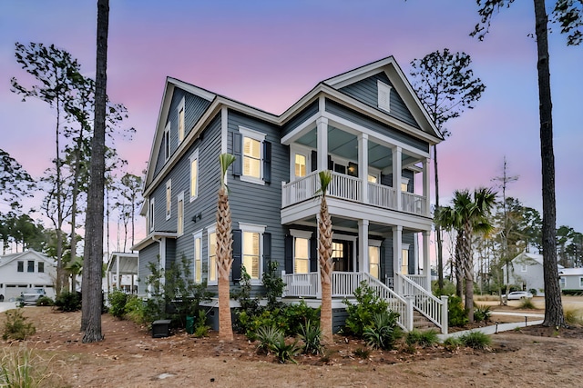 view of front of home with a balcony and a porch