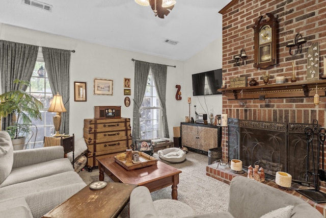 living room featuring carpet flooring, vaulted ceiling, and visible vents