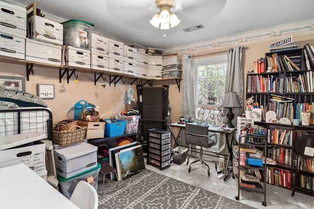 storage room featuring visible vents and ceiling fan