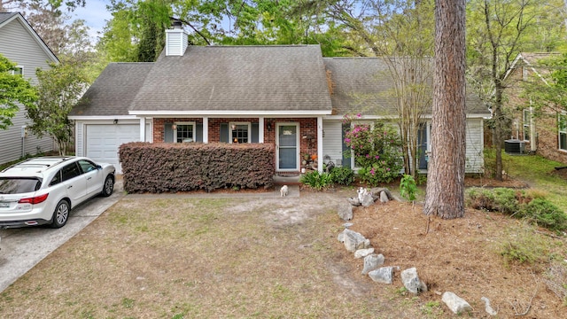 view of front of home featuring roof with shingles, brick siding, an attached garage, concrete driveway, and central AC unit
