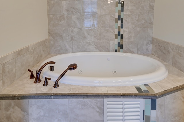 bathroom featuring tiled bath