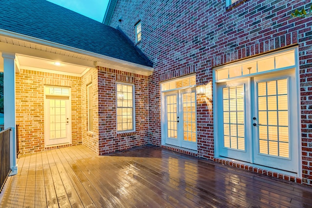 wooden deck featuring french doors