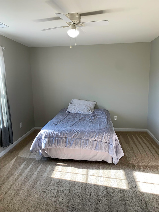 bedroom featuring ceiling fan and carpet floors