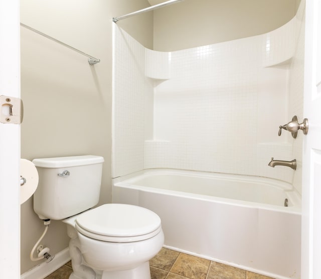 bathroom with shower / bathtub combination and toilet