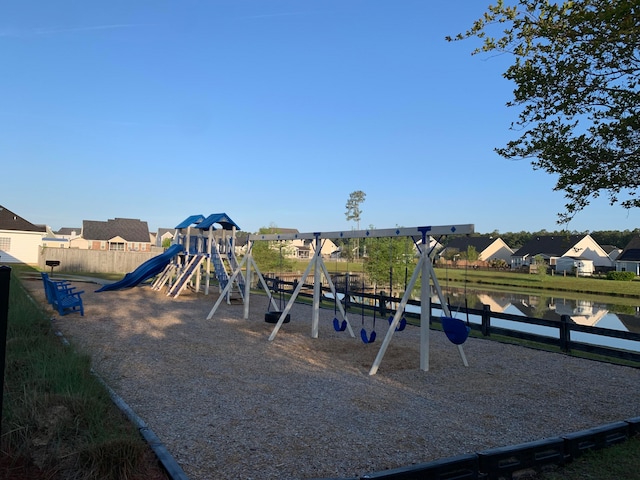 view of playground with a water view