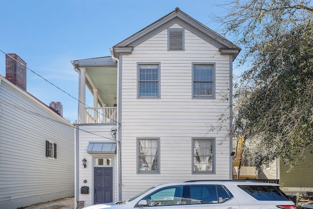 view of front of property with a balcony