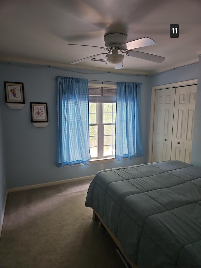 bedroom featuring a closet, ceiling fan, and carpet flooring