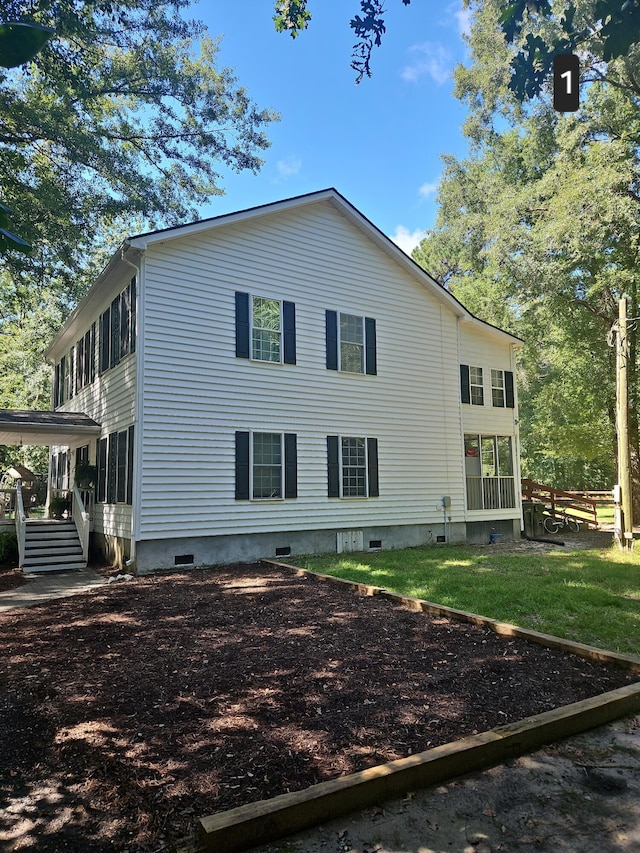 view of property exterior featuring a sunroom