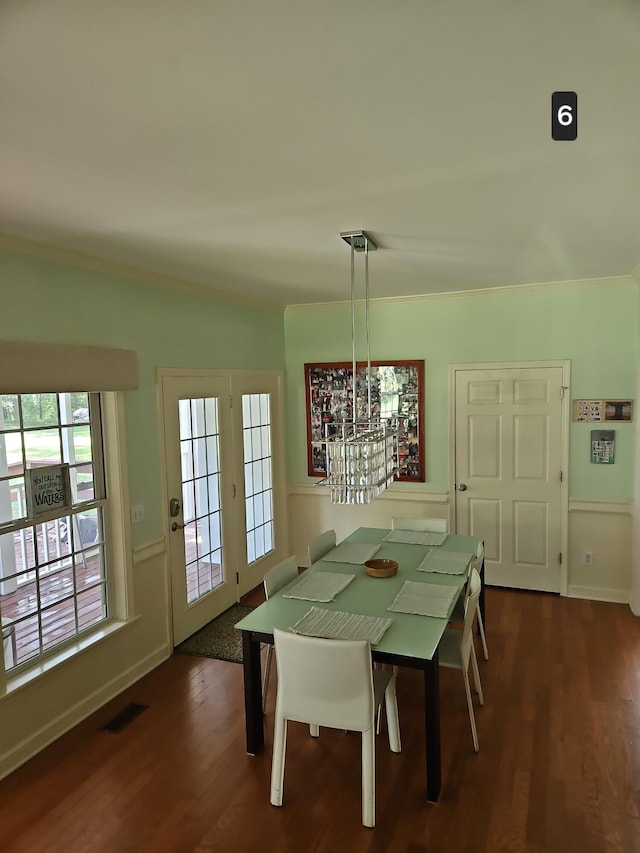 unfurnished dining area featuring dark wood-type flooring