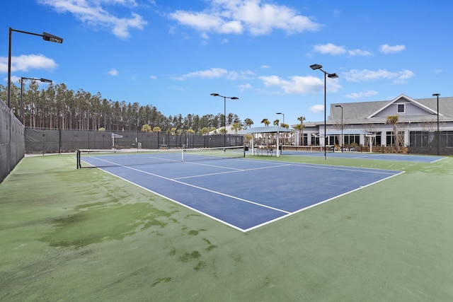 view of sport court featuring fence and community basketball court