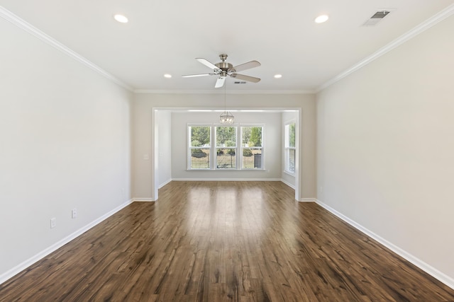 unfurnished room with crown molding, recessed lighting, dark wood-type flooring, baseboards, and visible vents
