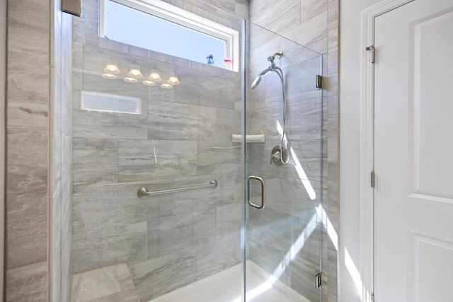 bathroom featuring a shower stall
