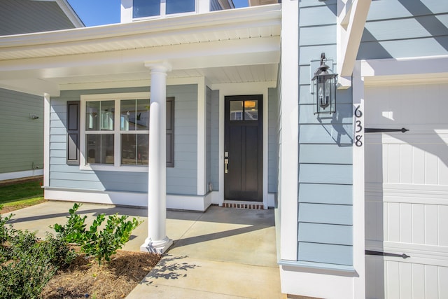 property entrance featuring a porch