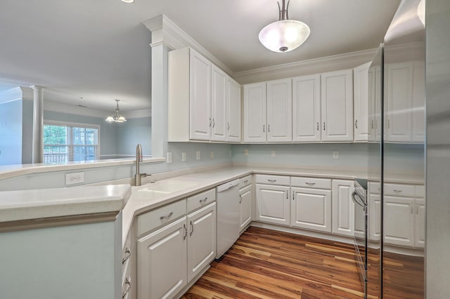 kitchen with dishwasher, a sink, ornamental molding, dark wood finished floors, and white cabinets