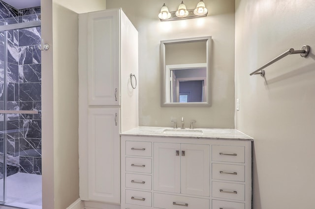 bathroom featuring a stall shower and vanity