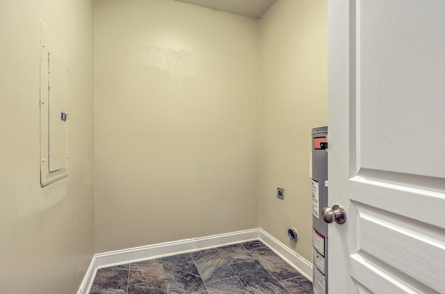 laundry area featuring electric dryer hookup, baseboards, water heater, and electric panel