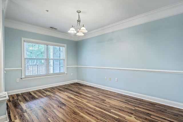 empty room with a chandelier, crown molding, dark wood-style floors, baseboards, and a pendent fire sprinkler