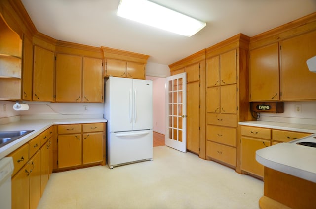 kitchen with white appliances, light countertops, light floors, open shelves, and a sink