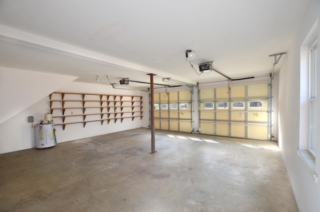 garage with a garage door opener and water heater