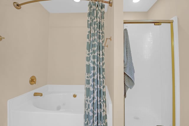 bathroom with separate shower and tub