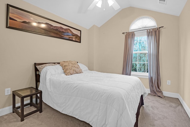 bedroom featuring ceiling fan, light carpet, and lofted ceiling