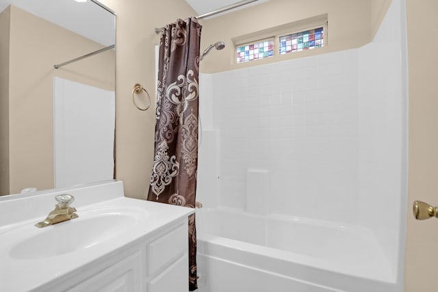 bathroom with shower / tub combo and vanity