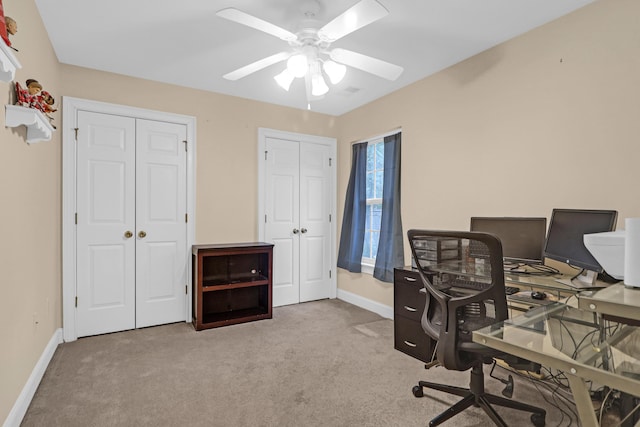 office area featuring ceiling fan and light colored carpet