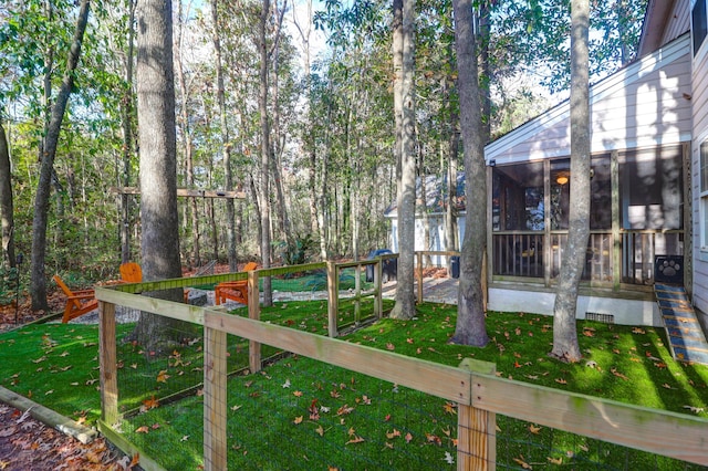 view of yard with a sunroom