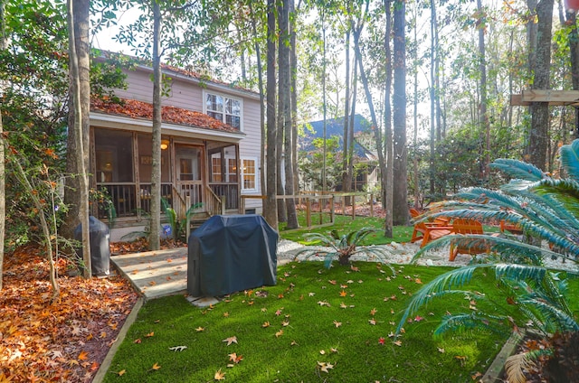 view of yard with a sunroom