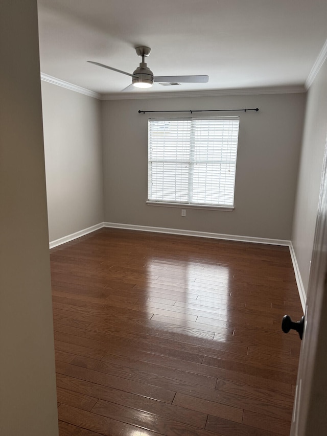 unfurnished room featuring crown molding, ceiling fan, and dark hardwood / wood-style floors