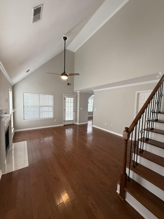 unfurnished living room featuring high vaulted ceiling, dark hardwood / wood-style floors, and ceiling fan