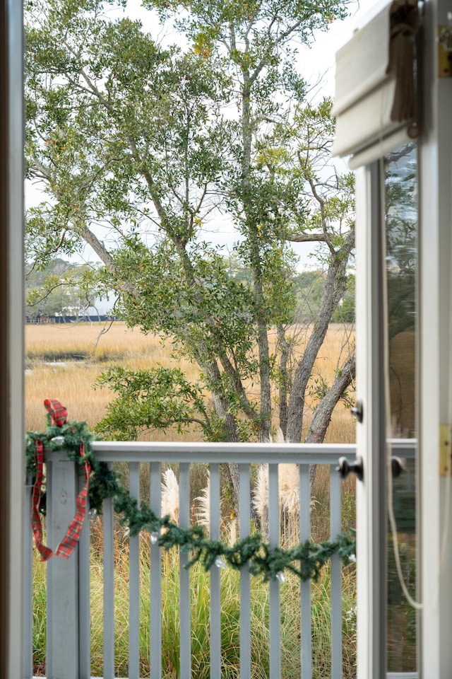 balcony featuring a rural view