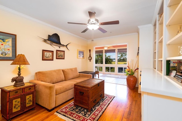 living room featuring crown molding, light hardwood / wood-style flooring, and ceiling fan