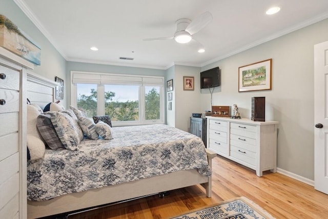 bedroom featuring ceiling fan, crown molding, and light wood-type flooring