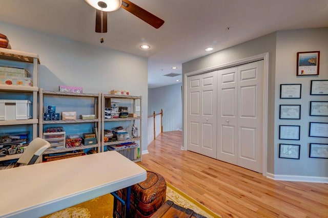 office area with ceiling fan and wood-type flooring