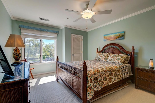 bedroom featuring carpet flooring, ceiling fan, and ornamental molding