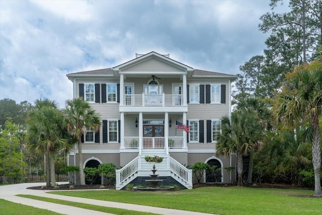 3547 Holmgren St, Mount Pleasant, SC 29466 - coastal inspired home with a balcony, stucco siding, a front lawn, stairs, and a porch