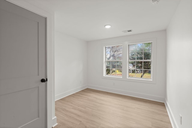 spare room featuring light hardwood / wood-style floors