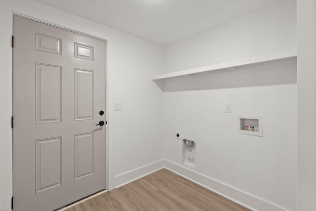 clothes washing area featuring electric dryer hookup, washer hookup, and light hardwood / wood-style floors