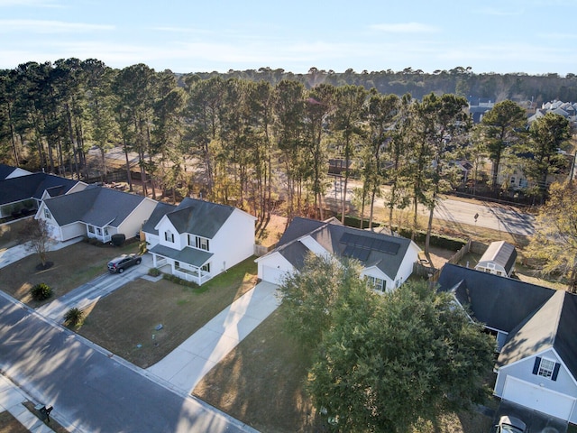 birds eye view of property with a residential view