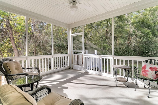 sunroom / solarium featuring wooden ceiling, ceiling fan, and plenty of natural light