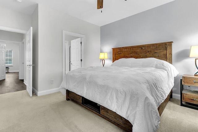 bedroom featuring ceiling fan and light colored carpet