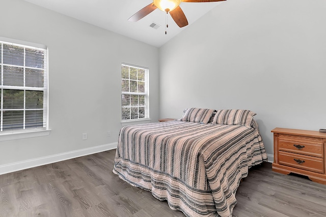 bedroom with wood-type flooring, vaulted ceiling, and ceiling fan